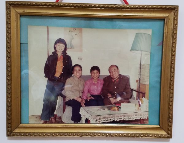 Nanqi at about age 22 with her parents and sister, Little Three