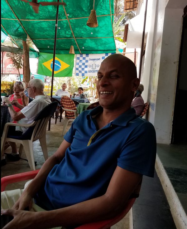 Antonio at Dinha's - he drives, waits table, and arranges trips