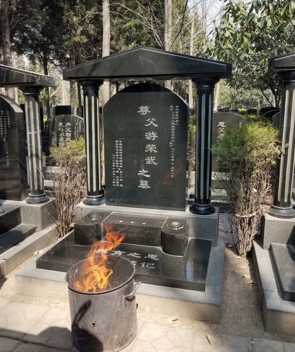 The ritual burning of paper money at the gravesite is a spiritual way of sending money to the deceased, so they will not suffer in the afterworld